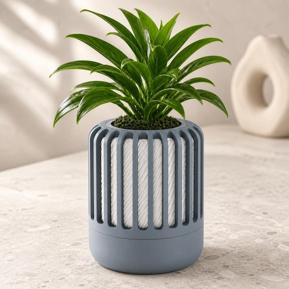 Close-up of the Reedshift indoor planter in Blue Grey and White Coastal Cloud colors