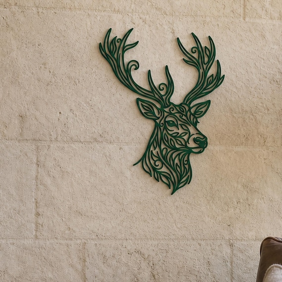Close-up of Deer Head filigree wall art in Bronze in a contrasting room