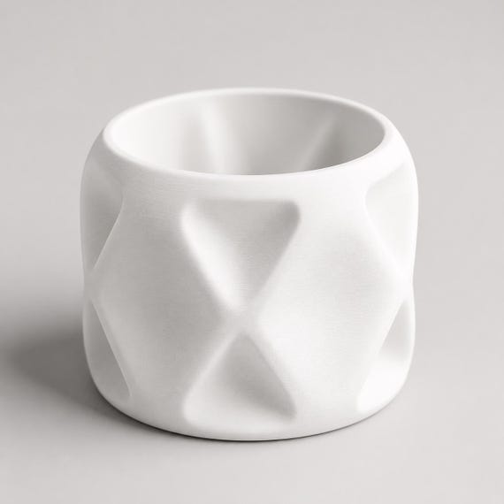 Close-up of an empty PillowFacet indoor planter in White showing the opening and soft diamond relief