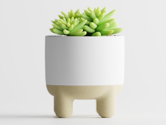 Front close-up of the CalmRise planter showing its balanced elevated silhouette
