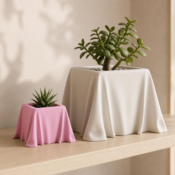 Close-up comparison of small Sakura Pink and large Bone White VeilCove planters
