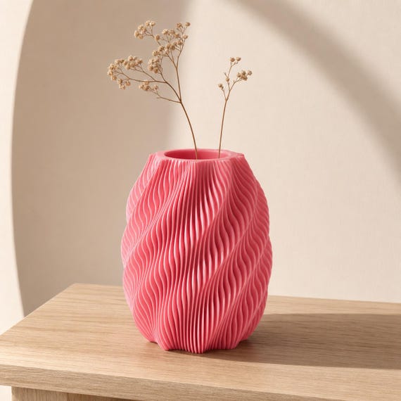 Quietflow organic wave vase in Pink styled with delicate dried flowers