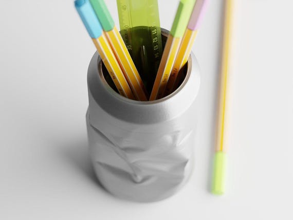 Close-up elevated view of the Original CrinklePop desk organizer filled with stationery