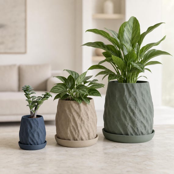 Close-up of three proportionally scaled Riftstone planters with matching trays