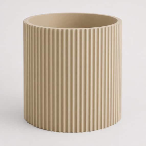 Rear three-quarter close-up of an empty Desert Tan StillRib vertical rib planter