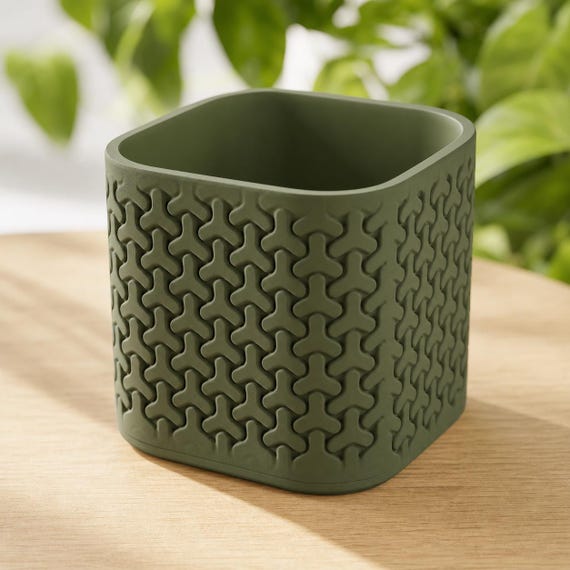 Elevated close-up of an empty medium TriLoom geometric planter in Dark Green