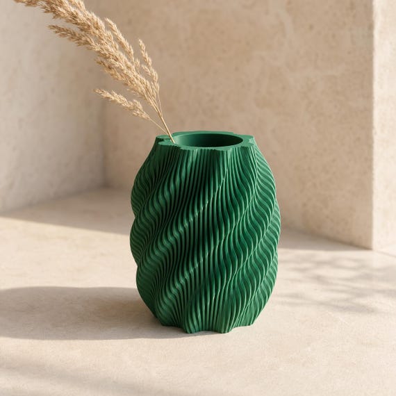 Quietflow modern vase in Mistletoe Green with a dried grass stem