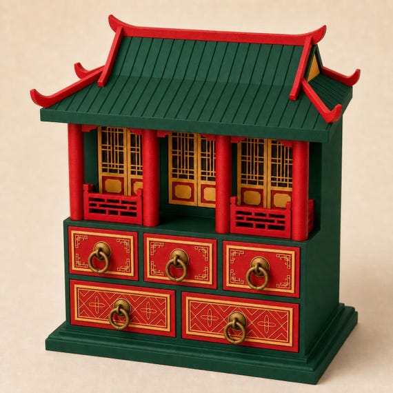 Jade Green pavilion keepsake chest with scarlet pillars and drawer fronts, antique-gold lattice panels and ring pulls, front three-quarter view