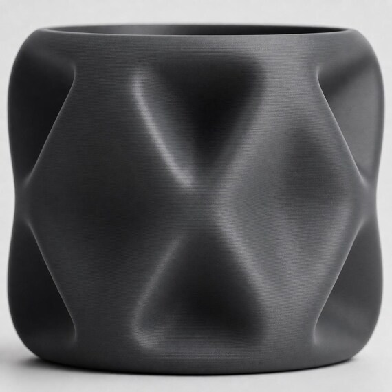 Macro close-up of the PillowFacet soft diamond relief and fine surface texture in Dark Grey