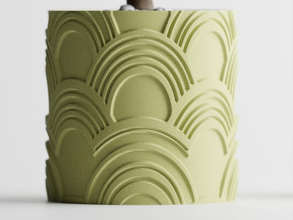 Straight-on close-up of the repeating recessed arch pattern on an ArcEcho planter