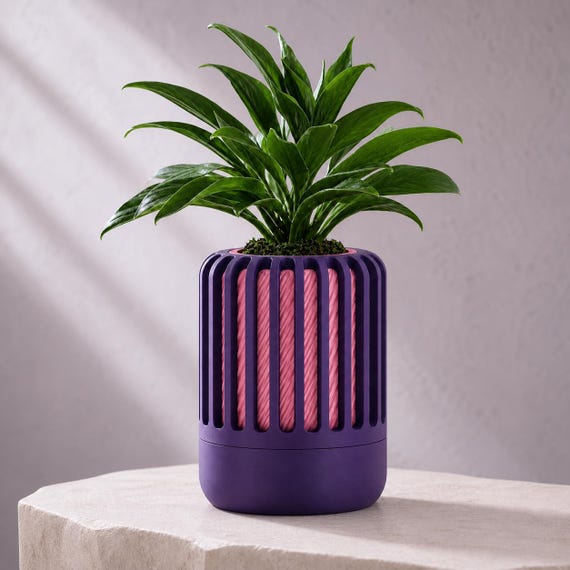 Close-up of the Reedshift ribbed planter in Indigo Purple and Pink Orchid Dusk colors