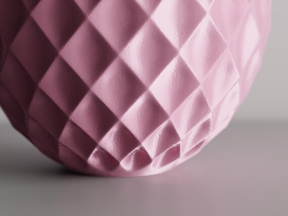 Extreme close-up of the GemLattice vase raised geometric facets and light-catching texture