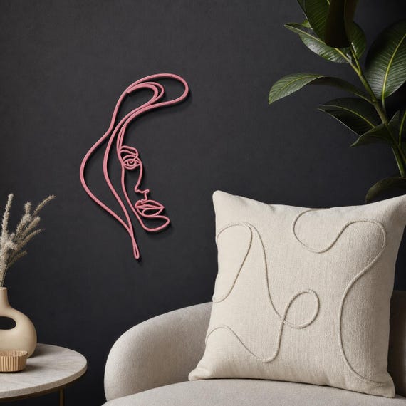 Elegant Woman Profile wall art in Pink in a contrasting showcase room
