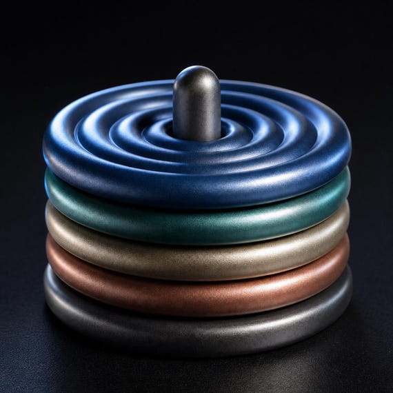Close-up of the AxisRipple five-coaster set and holder in the shiny Metallic theme