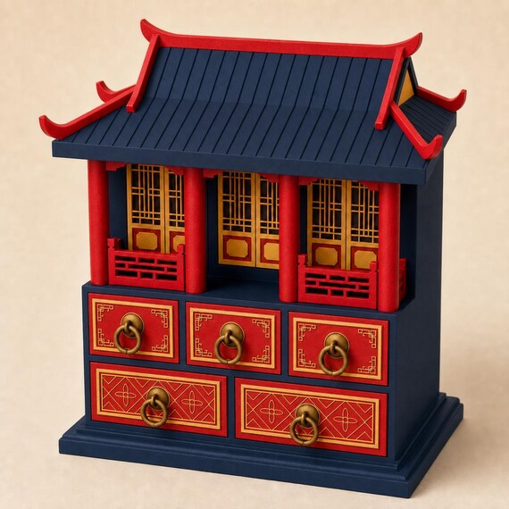 Palace Blue pavilion keepsake chest with scarlet pillars and drawer fronts, antique-gold lattice panels and ring pulls, front three-quarter view