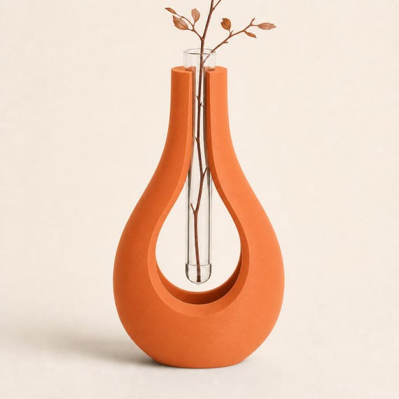 Close-up of the AerialArc single flower tube holder in Terracotta with a clear 15 mm tube