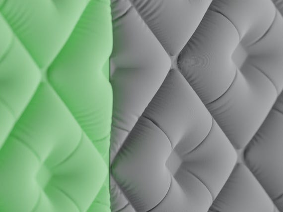Macro close-up of TuftWeave wall tiles showing pillowy diamond forms and gathered centers