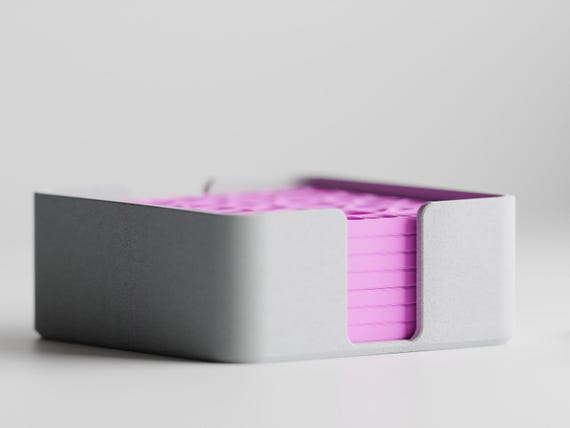Front close-up showing the complete CanopyLace coaster stack through the holder opening