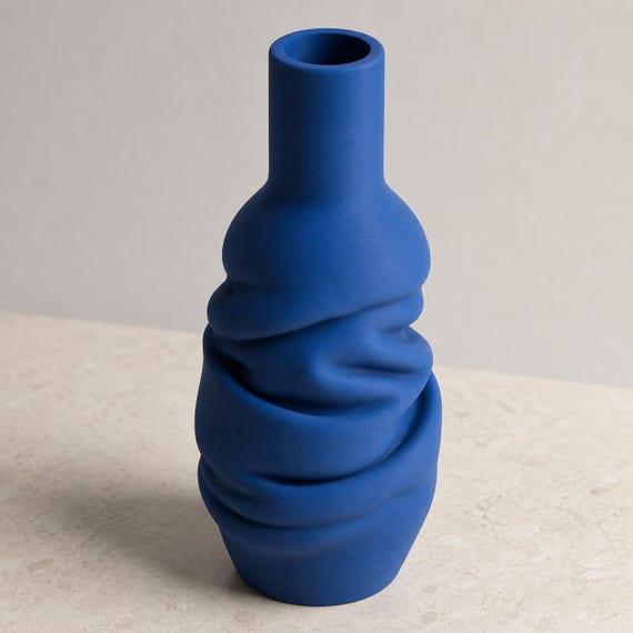 Elevated close-up of the Marine Blue DrapeForm Wrapped Column vase and open rim
