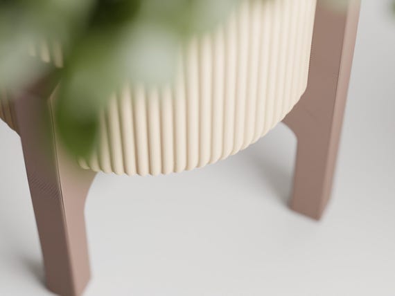 Close-up of the RidgeRest planter ribbed lower edge and Latte Brown four-leg frame