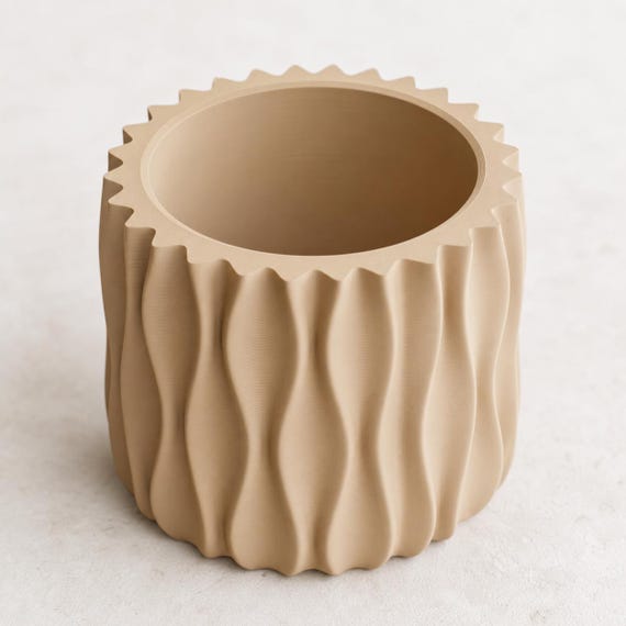 Close-up top view of an empty Desert Tan WaveLoom planter showing the circular opening