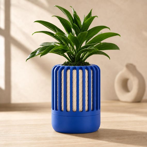 Close-up of the Reedshift orchid planter in Cobalt Blue and Beige Cobalt Sand colors