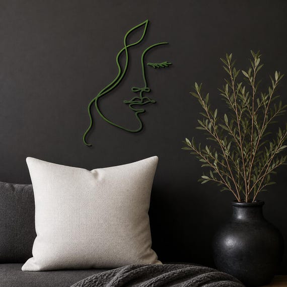 Leaf Woman Face wall art in Forest Green in a contrasting showcase room