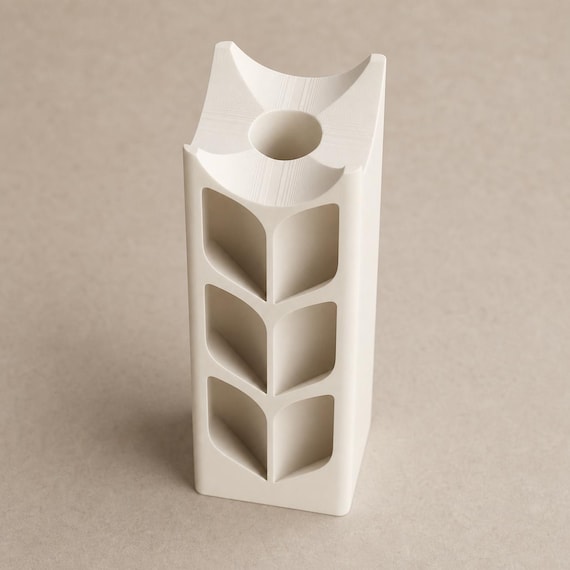 Close-up high angle of the Bone White ArborLume vase showing its sculpted top and stem well