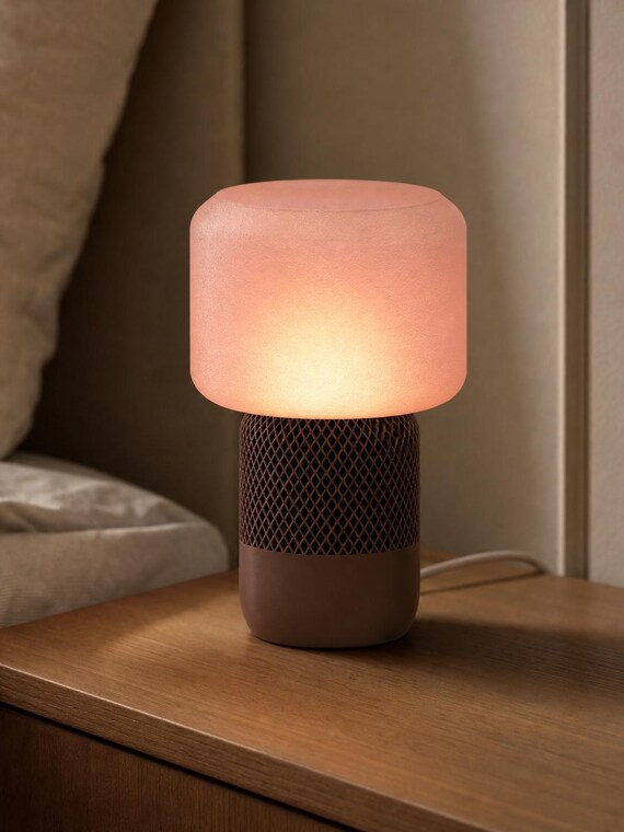 Cocoa Blush MeshGlow table lamp with Cocoa Brown base and textured Pink shade on a nightstand