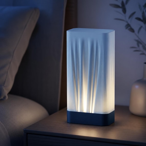 Midnight Frost Woven Glow bedside lamp with Dark Blue base and Ice Blue closed-top shade