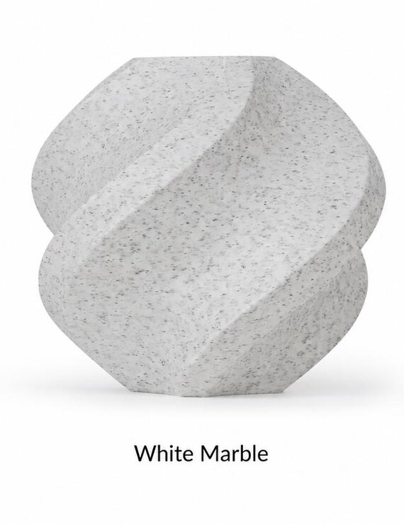 White Marble finish reference showing a white surface with fine gray speckles, available for Arcloom outer arches.
