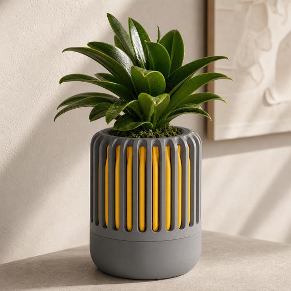Close-up of the Airloom ventilated planter in Dark Grey and Sunflower Yellow Solar Slate colors