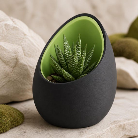 Close-up of the CovePod planter in Moss Shadow with Charcoal outer and Apple Green inner