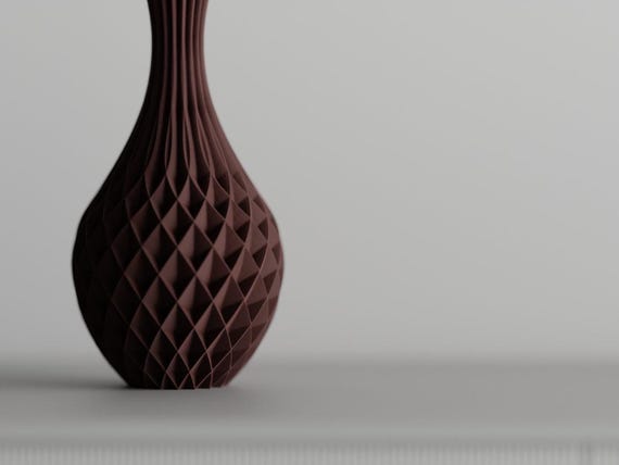 Close-up of the PrismWeave vase showing its flowing diamond lattice relief