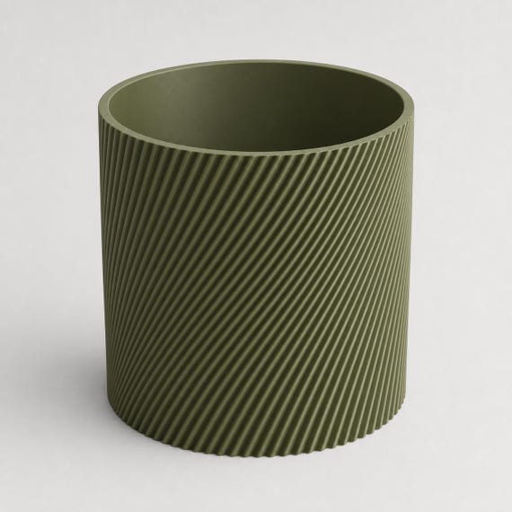 Elevated close-up of an empty Dark Green SlantThread planter showing its round opening