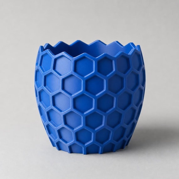 Elevated close-up of the empty HexaGrove planter in Cobalt Blue showing its zigzag rim