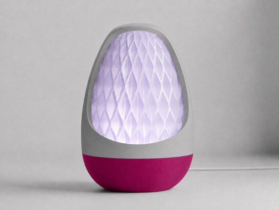 Lumenvale USB lamp in Orchid, assembled with a Ash Gray frame, Plum base and glowing Lavender patterned shade on pale gray.
