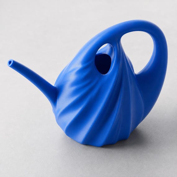 Elevated close-up of the small TideArc watering can in Cobalt Blue showing its fill opening and handle
