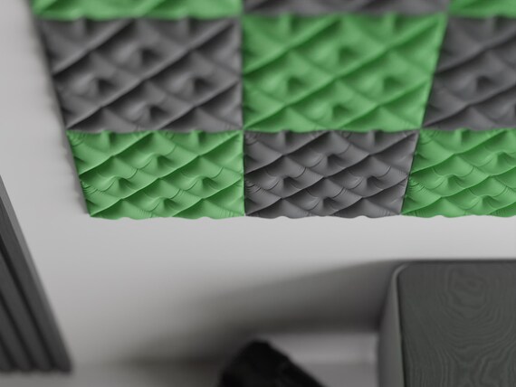 Angled close-up of green and charcoal TuftWeave wall tiles showing tufted relief depth