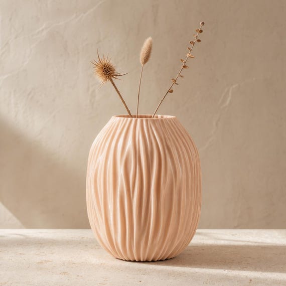 Close-up of the Tidegrove Tall Vase in pearlescent Silk Champagne with dried stems