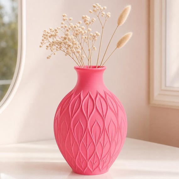 Close-up of the Hot Pink CanopyMuse leaf relief vase with delicate cream dried flowers