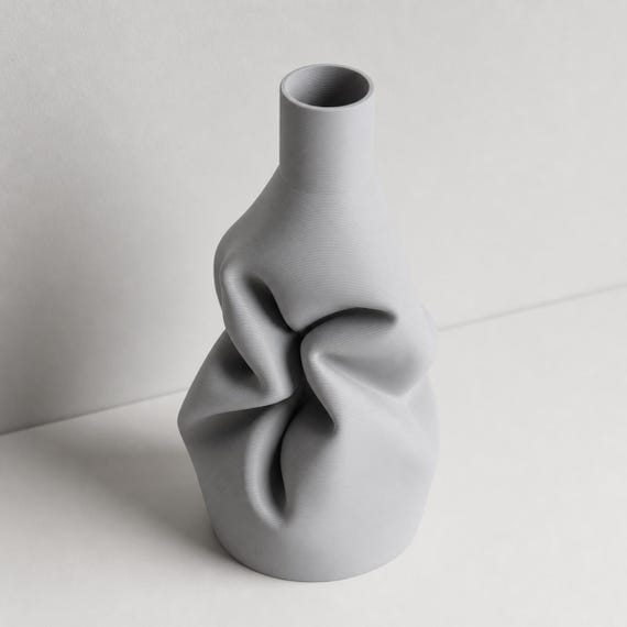 Elevated close-up of the Ash Gray DrapeForm Gathered Fold vase and its open rim