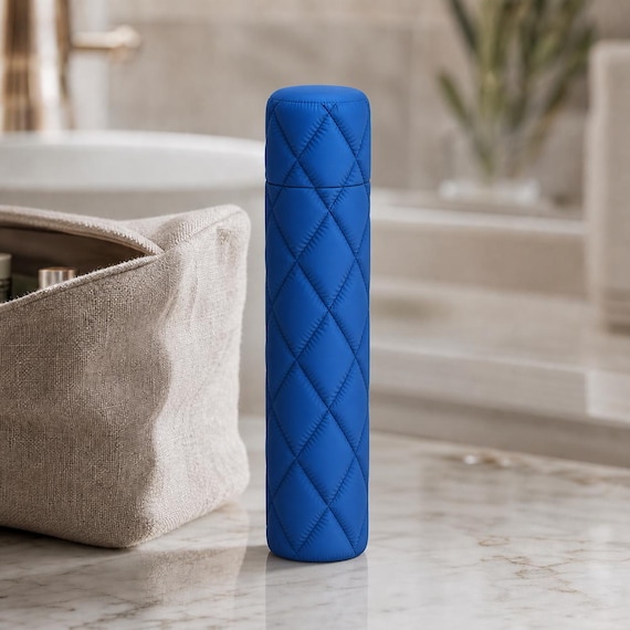 Close-up of the complete tall Cloudquilt toothbrush travel case in Marine Blue