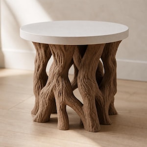 May include: A round side table featuring a smooth, off-white circular top surface supported by a base sculpted to resemble a cluster of brown tree roots with a textured, bark-like finish that extends outward to form the legs of the furniture piece.