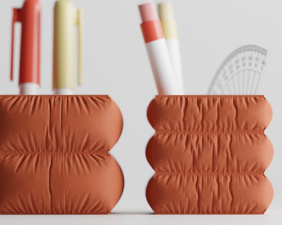 Front close-up comparing the two finished CushionCove pen holder silhouettes
