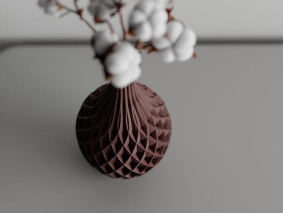 High-angle close-up of the PrismWeave vase body, fluted neck, and stem opening