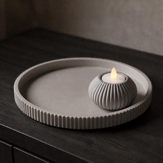Close-up of the Solenne LED tealight holder and foundation tray in Ash Gray