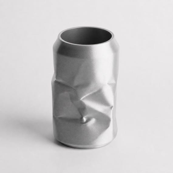 Close-up of an empty CrinklePop desk organizer in Silk Silver showing the hollow opening and folded form