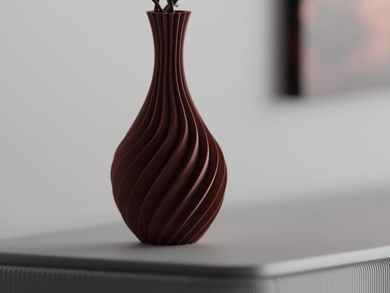 Close-up of the SwaySpire vase teardrop body and flowing ribbed surface