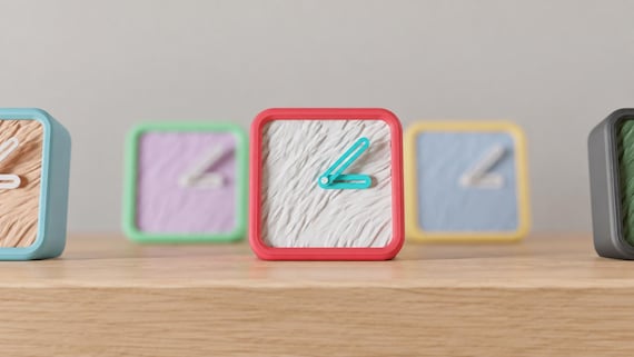Meadowgrain Textured Desk Clock green textured face and dark frame in a close source-referenced view on oak.